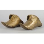 A pair of gilded brass shoes for horse riding, Spanish South America, 18th century, 27.5cm. long (2)