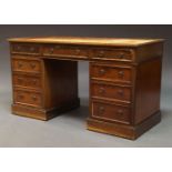 A Victorian mahogany pedestal desk, the rectangular top inset with brown leather writing surface,