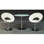 A contemporary circular table, the glass top on central chromed support, 74cm high x 80cm