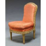 A Louis XVI style gilt side chair, the frame with overall moulded foliate decoration, upholstered in