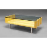 A contemporary satinwood and glass coffee table, the shaped top top with undulating edges,