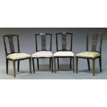 A set of four ebonised and parcel gilt side chairs, early 20th Century, the top rail carved with