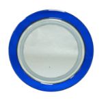 A circular illuminated wall mirror, c.1960sWith bevelled blue glass border, the reverse with seven
