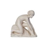 A carved ivory figure c. 1920, unsignedCarved as a naked young woman, kneeling and drying her feet