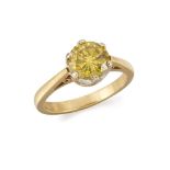 An 18ct. gold, treated coloured diamond single stone ring, the treated yellow circular-cut diamond