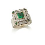 An emerald & diamond square cluster ring, in the form of an early 20th century square-cut emerald
