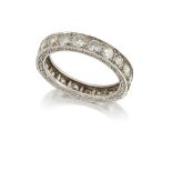 A platinum, diamond eternity ring, set with a single row of circular-cut diamonds the hoop with