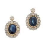 A pair of sapphire and diamond cluster earrings, each oval-cut sapphire in collet mount with