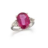 A pink tourmaline and diamond ring, the oval claw-set pink tourmaline weighing approximately 4.55