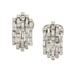 A pair of diamond cluster ear clips, each domed cluster panel composed of five-rows of alternately-