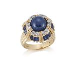 An 18ct. gold, sapphire and diamond ring, by Kutchinsky, the domed cluster set in the centre with
