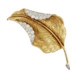 An 18ct gold diamond brooch, designed as a stylised leaf with pave diamond folds, diamond set stem