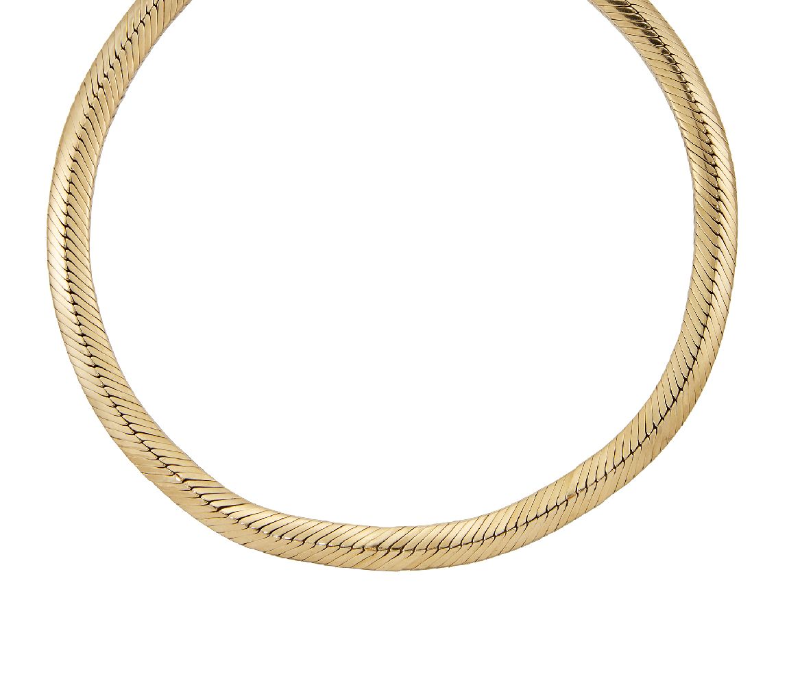 A flexible collar necklace, by Cartier, composed of a series of ridge-shaped herringbone style