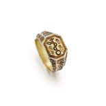 A 15th century silver-gilt merchant's ring, the central octagonal bezel with engraved with a