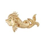 An 18ct. gold brooch, by Chaumet, designed as a heraldic style dolphin set with a circular-cut