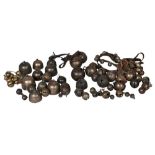 A quantity of copper alloy horse and crotal bells, late 18th/19th century, some with initials,