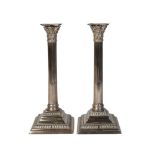 A pair of George III paktong candlesticks, of neo-classical form, circa 1760, each with stop-flutted