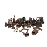 A quantity of bronze and iron bells, mostly 19th century, of various forms, including Swiss cow