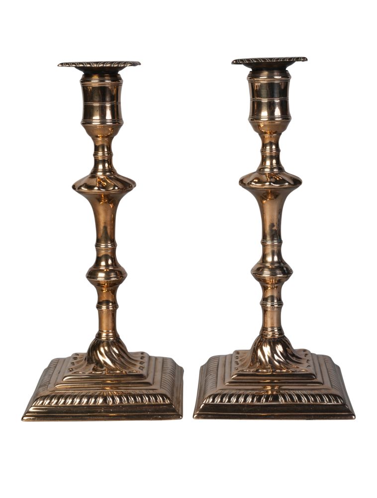 A pair of George III brass candlesticks, third quarter 18th century, each with double knopped stem