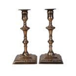 A pair of George III brass candlesticks, third quarter 18th century, each with double knopped stem