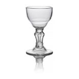 A George I wine goblet, c. 1720, with double ogee bowl, above a double annulated knop, on a pedestal