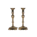 A pair of George III brass candlesticks, third quarter 18th century, each with knopped stem and