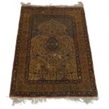 An Isfahan silk prayer rug with oval medallion in ivory mihrab, the ivory field with tree of life,