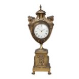 A French Empire ormolu clock, 19th century, of urn form with female winged terminal handles, on a