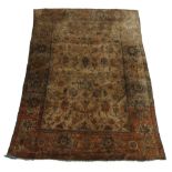 A Turkish silk rug, early 20th Century, with all over scrolling foliate and floral design in an