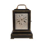A French ebonised and brass mounted mantel clock, 19th century, the rectangular case with looping