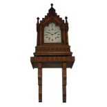 A Victorian oak gothic cased bracket clock, the case of architectural form with ornately carved door