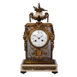 A French white marble and gilt bronze mantel clock by Chiout, 19th century, with an urn finial to