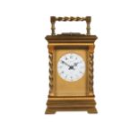 A French brass repeating carriage clock, 19th century, the case of architectural design with twisted