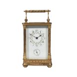 A Matthew Norman gilt carriage clock, 20th century, with ornate twist columns and plain capitals,