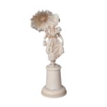 A French ivory model of a young girl carrying a parasol, 19th century, wearing a high bonnet and a