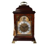 A Victorian mahogany bracket clock, in the George III taste, with brass carrying handle to the domed