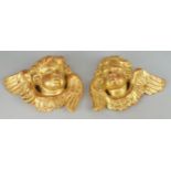 Two Italianate gilt plaster cherubs heads, of recent manufacture, looking to the left and right,