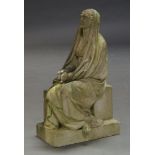 A carved and weathered marble figure of a woman seated on a plinth, probably a memorial sculpture,