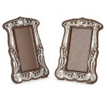 A matched pair of Art Nouveau silver and oak photograph framesMark of Walker & Hall, Sheffield