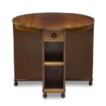 Heal & Son, a walnut 'Book' tableEarly 20th Century, The circular top over two fitted drawers with