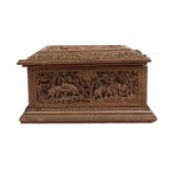 A deeply carved sandalwood chest with hunting scenes, India, 19th century, of rectangular form,