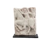 A limestone plaque depicting a man on horse, Byzantine, circa 4th-6th century AD, mounted on a