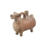 A small terracotta bull rhyton, on four squat feet, with round handle and spout to back, 13cm.