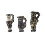 Three small glass vessels, possibly Roman, 2nd-4th century AD, each approx. 1ch. high (3)