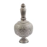 A tall silver lidded bottle vase with repousse decoration, India, 19th/20th century, on a high