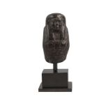 An Egyptian fragmentary steatite ushabti, mounted on a plinth, 9cm. highProvenance: Ex. Wayne