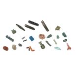 A group of various Egyptian amulets, of various periods, including a scarab, faience beads, a