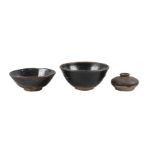 Three pieces of Chinese stoneware, Song dynasty, comprising two black-glazed bowls, 16.5cm and