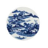 A Chinese porcelain circular plaque, early 19th century, painted in underglaze blue with fisherman