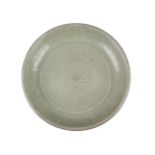 A Chinese grey stoneware Longquan celadon glazed bowl, Ming dynasty, 15th century, moulded with